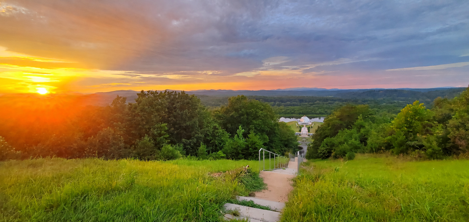 Yogaville ashram at sunset with golden sky